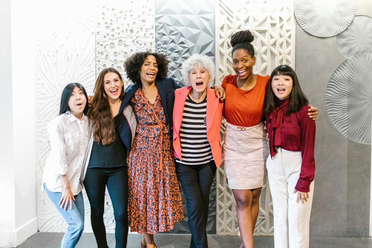 diverse group of women smiling for a photo